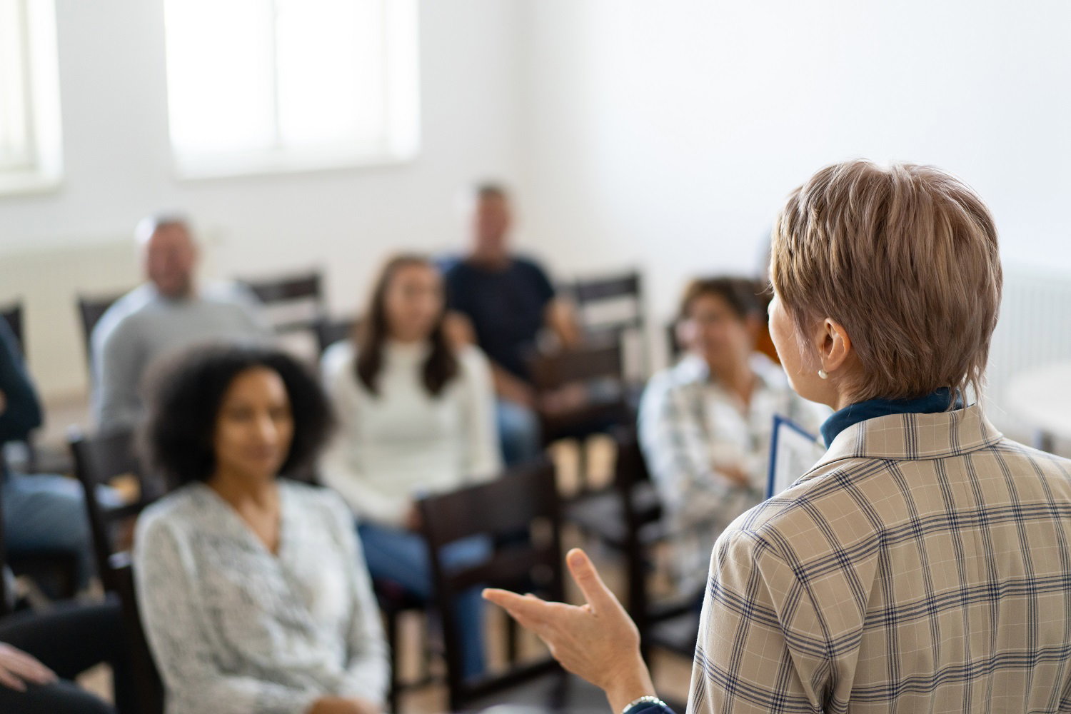 Mortgage professionals participating in an instructor-led continuing education course
