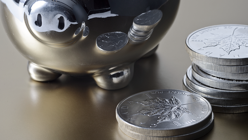 Biggy bank with silver coins